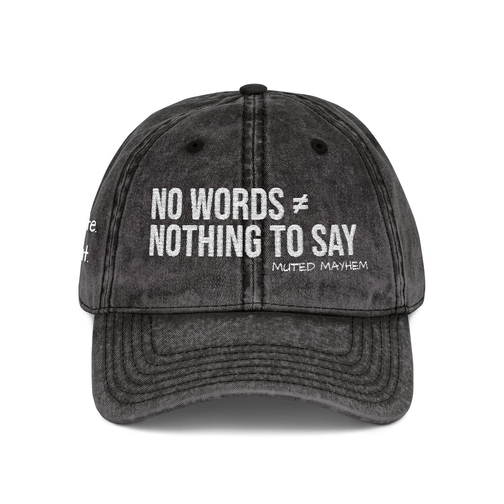 A dark gray acid-wash baseball cap with white embroidered text reading 'NO WORDS ★ NOTHING TO SAY' and 'MUTED MAYHEM' underneath, shown on a plain white background.