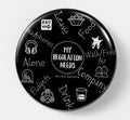 A round black pinback button featuring white hand-drawn style icons and text related to the Muted Mayhem music festival, including 'MY REGULATION NEEDS' in the center and words like 'Leave', 'Food', 'Company', and 'Drink' around the border.