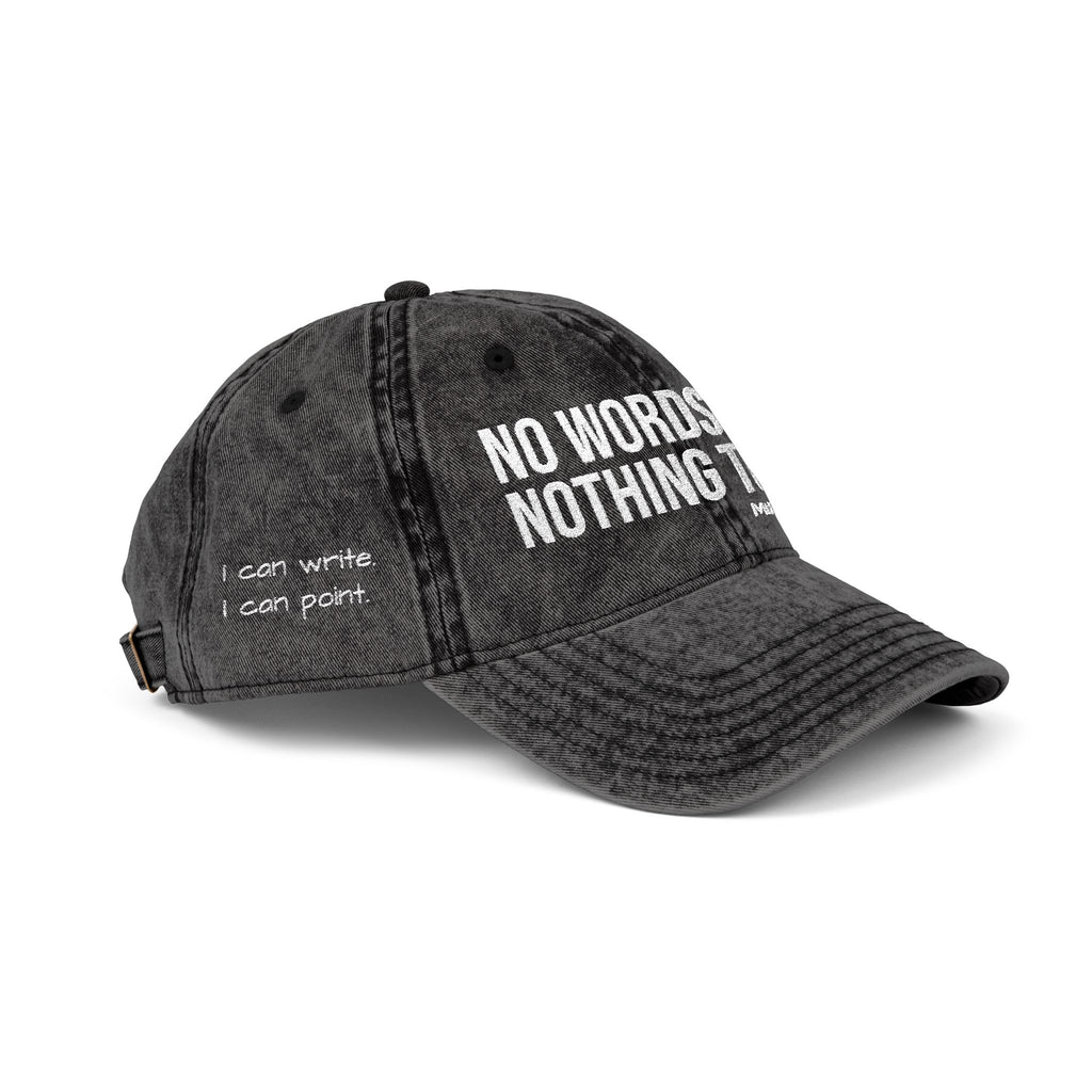 Black denim cap with 'I can point. I can write' text on a white background